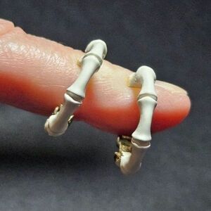Crown Trifari gold tone and white clip on hoop earrings